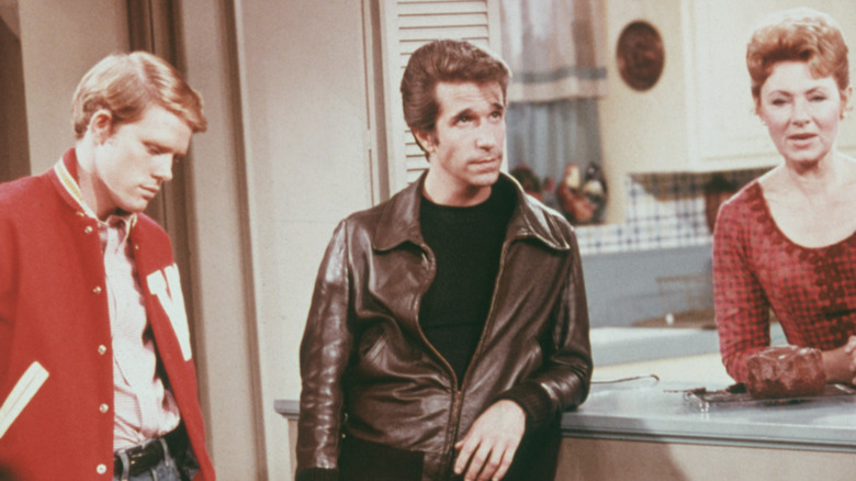 Henry Winkler, Ron Howard, and Marion Ross on the set of 'Happy Days', circa 1975.