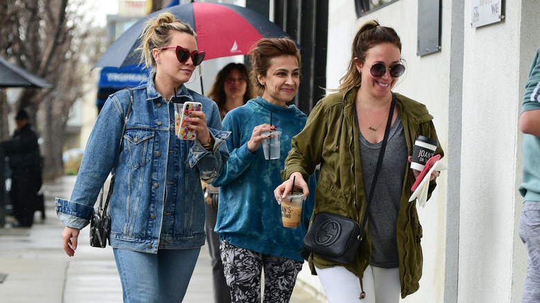 Hilary and Haylie Duff walking on the street together in 2019