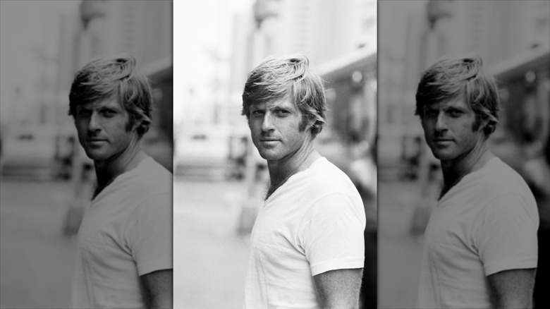 A young Robert Redford looks off to the side
