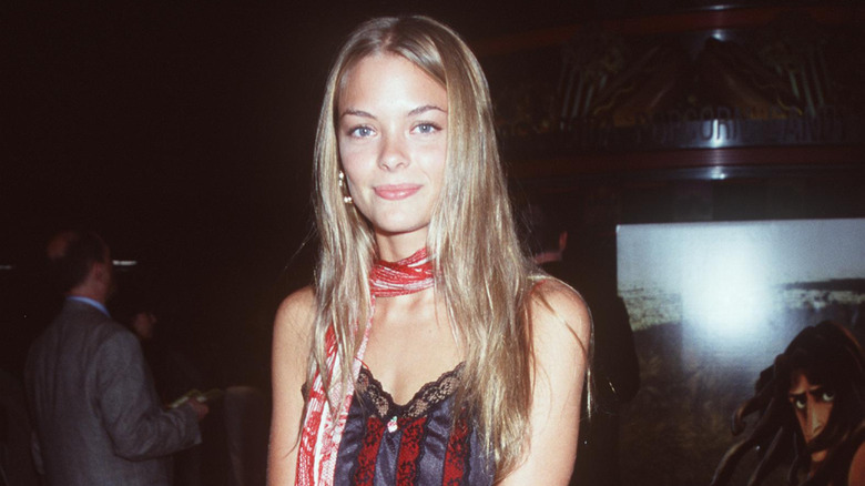 Jaime King with long hair and red and white scarf