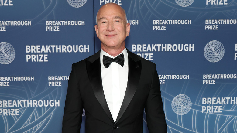 Jeff Bezos smiling in a tuxedo