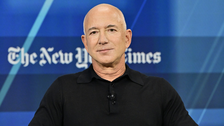 Jeff Bezos looking at the camera in a black shirt