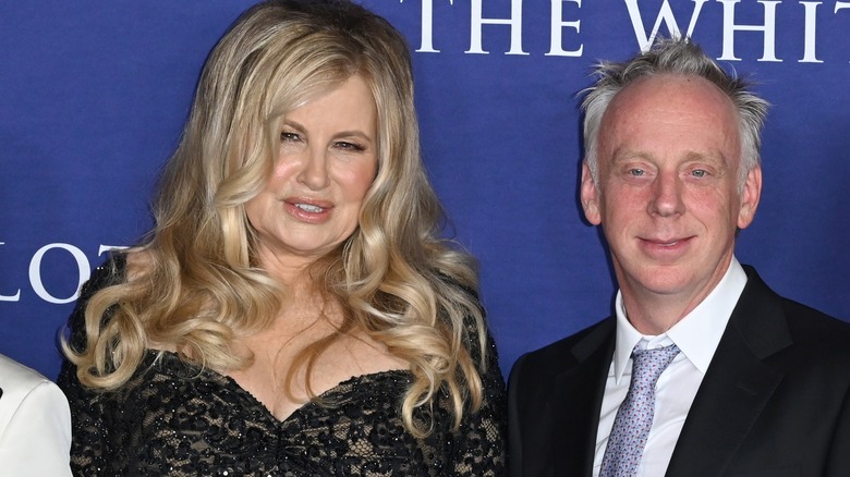Jennifer Coolidge and Mike White smiling