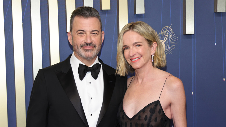 Jimmy Kimmel and Molly McNearney pose for photos