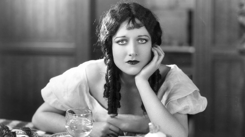 Joan Crawford posing in pigtails