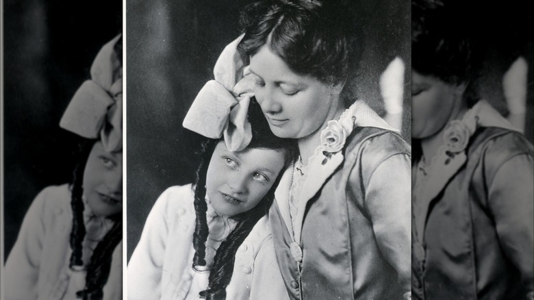 Nine-year-old Joan Crawford sits with her mother