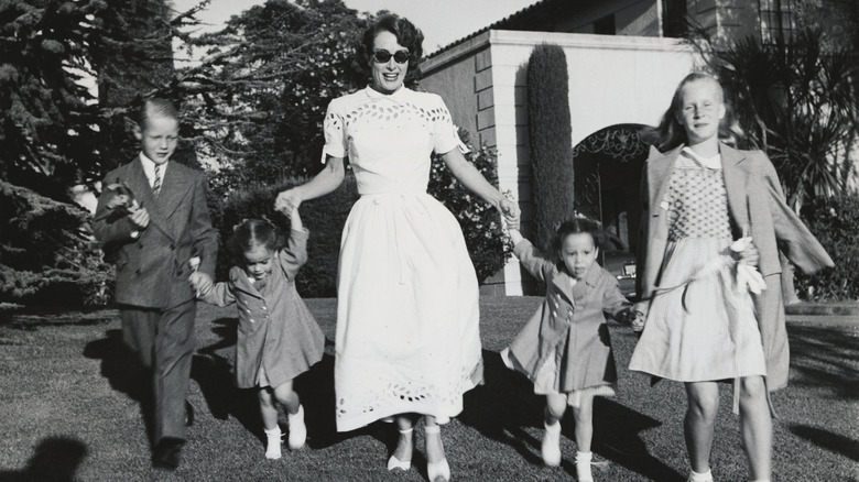 Joan Crawford smiling with her children