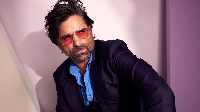 actor John Stamos posing with sunglasses