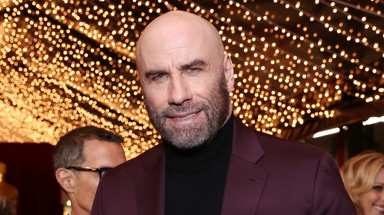 John Travolta smiling. 