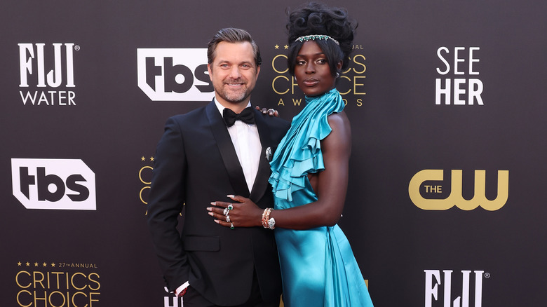 Joshua Jackson and Jodie Smith-Turner posing for photos together in their finery