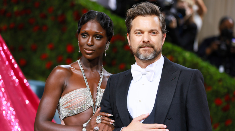 Joshua Jackson and Jodie Smith-Turner posing for photos in their finery