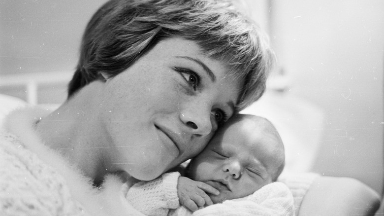 Julie Andrews cuddling her baby daughter Emma Walton