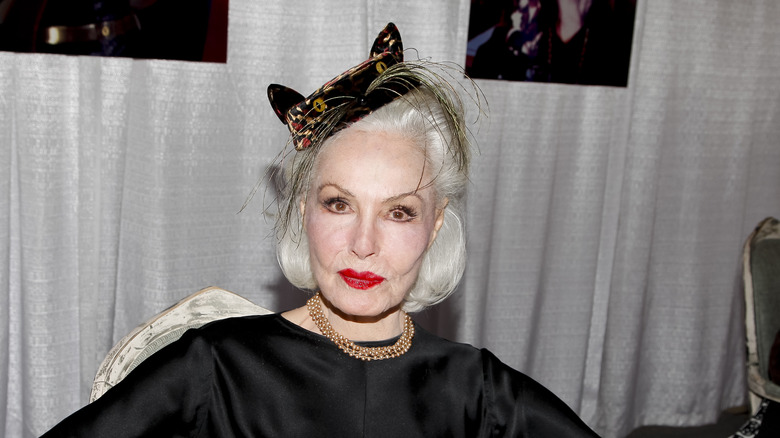 Julie Newmar wearing cat ears