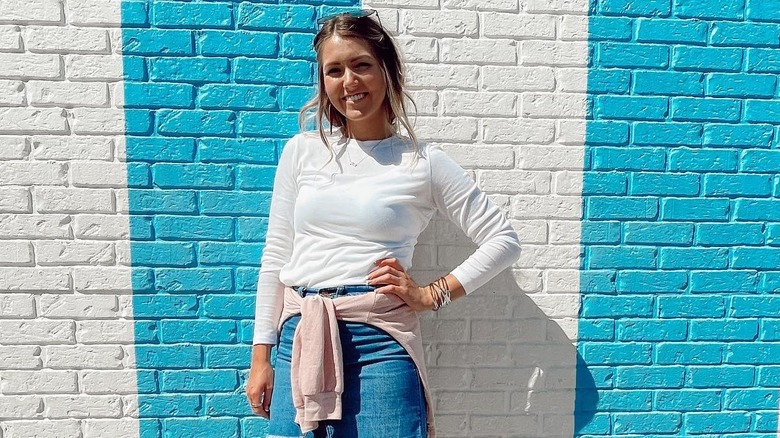 Kennedy Noem smiling with one hand on her hip