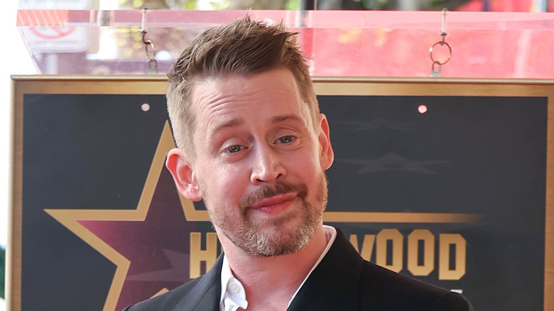 Macualay Culkin smiling at Hollywood Walk of Fame ceremony