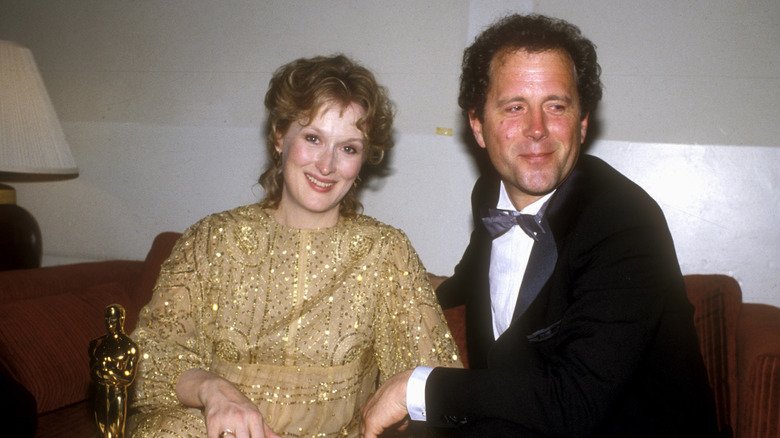 Meryl Streep in a golden dress with Don Gummer