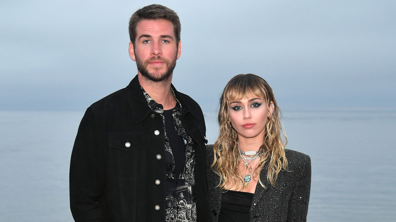 Liam Hemsworth and Miley Cyrus at mens spring summer fashion show
