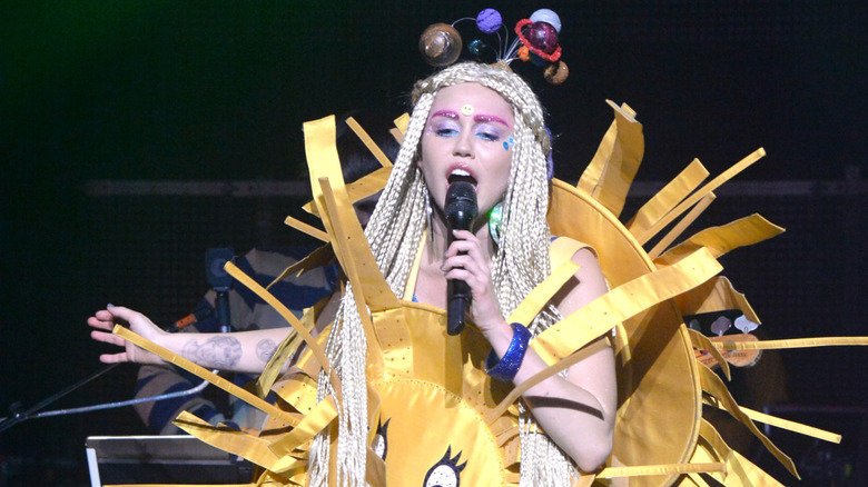 Miley Cyrus performing at The Wiltern wearing a sun costume