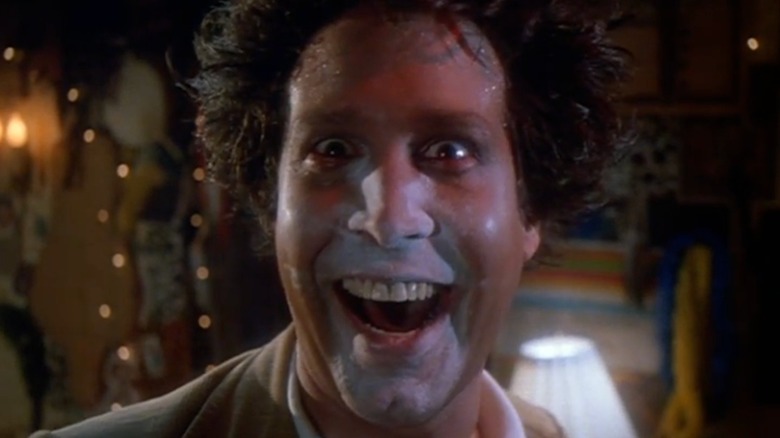 Chevy Chase with hair sticking up and white powder on face in "Modern Problems"