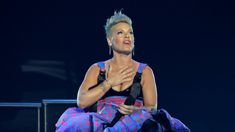 Pink sitting on stage