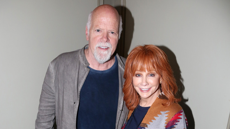 Rex Linn and Reba McEntire smiling