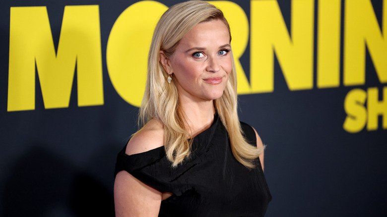 Reese Witherspoon wearing black and smiling