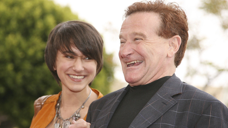 Zelda Williams and Robin Williams smiling