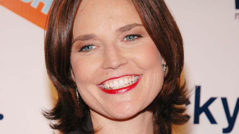Close-up of Savannah Guthrie smiling with a dark bob in 2004