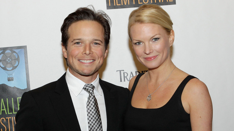Scott Wolf in a black tie and Kelley Wolf in a black dress
