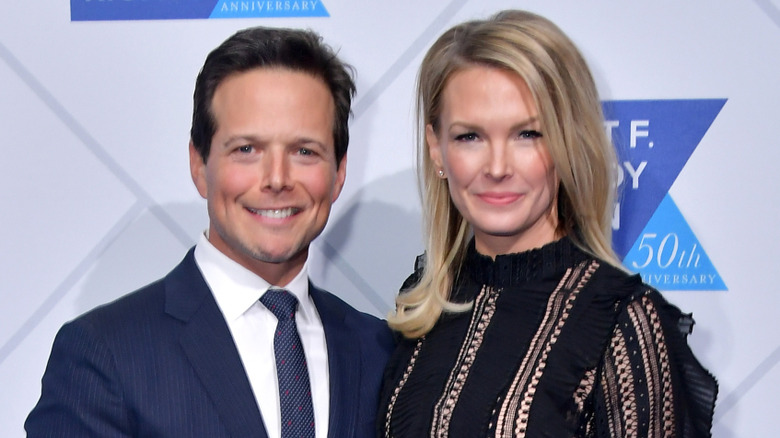 Scott Wolf wearing a blue tie and Kelley Wolf wearing a black top