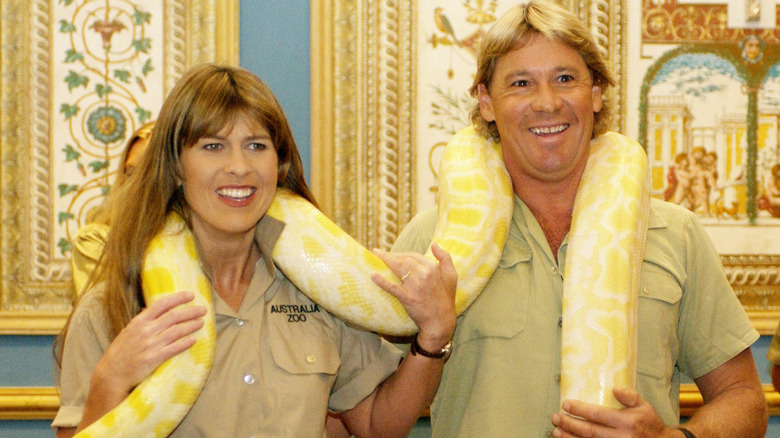 Terry Irwin and Steve Irwin hold a giant snake in 2002.