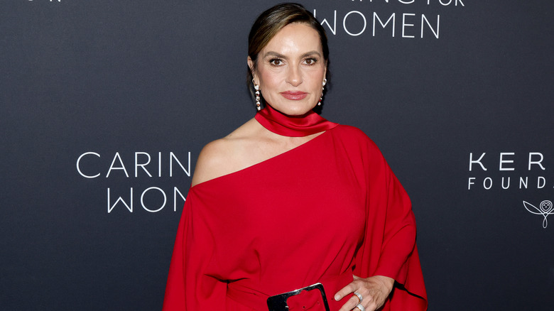 Mariska Hargitay posing for photos in a red dress