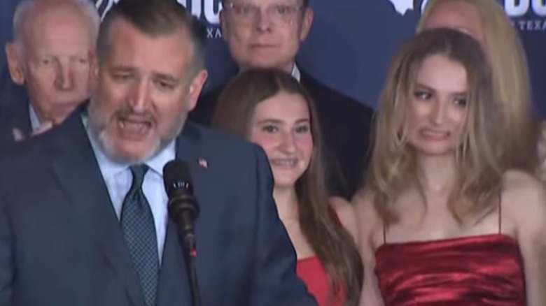 Ted Cruz speaking while Caroline Cruz grimaces