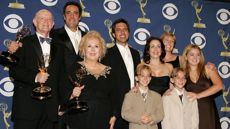 The cast of Everybody Loves Raymond holding Emmy Awards