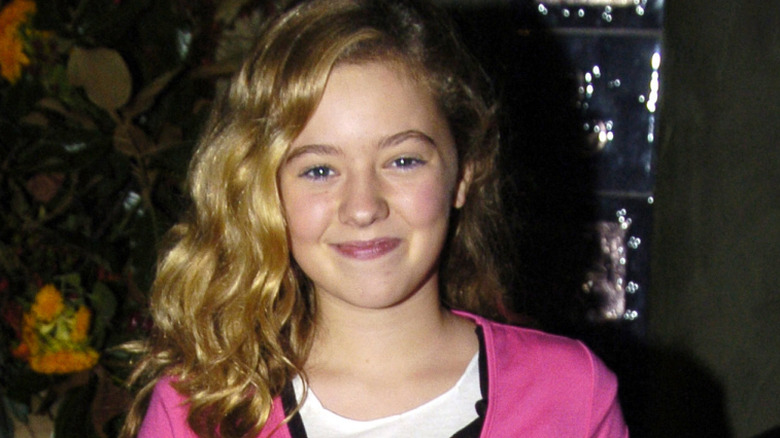 Madylin Sweeten when she was a kid, smiling for a photo