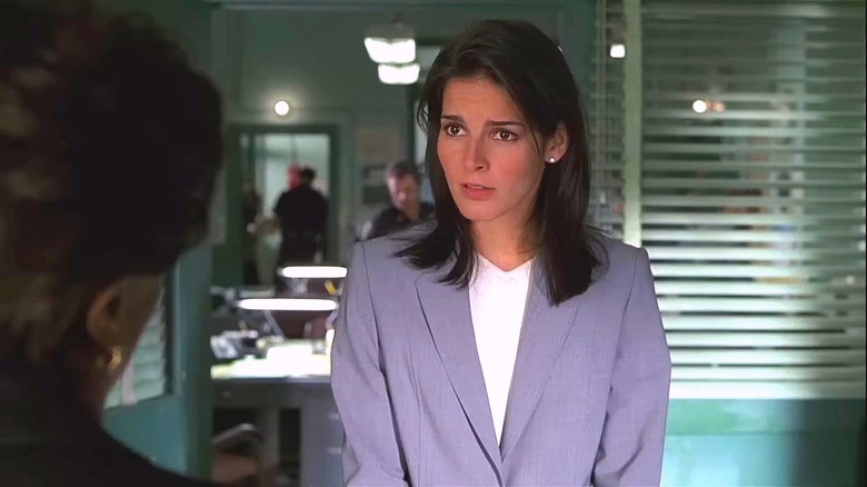 Angie Harmon as Assistant D.A. Abbie Carmichael, in an office on "Law & Order"