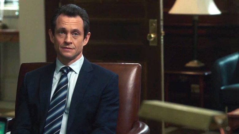 Hugh Dancy as Executive Assistant D.A. Nolan Price, sitting in a big leather chair on "Law & Order"