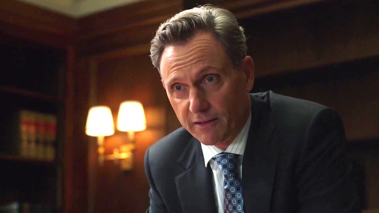 Tony Goldwyn as D.A. Nicholas Baxter on "Law & Order," with two lamps in the background.