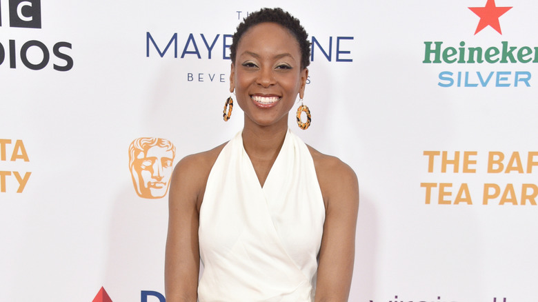 Tracy Ifeachor smiling on step-and-repeat