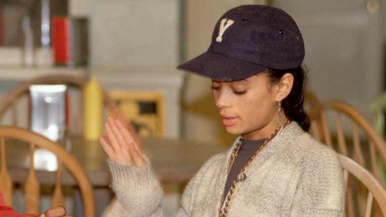 A young Lisa Bonet on A Different World, holding up her hand to stop someone from talking