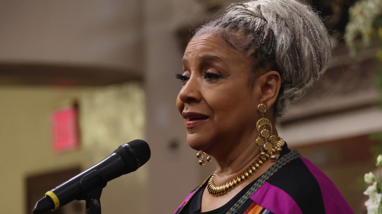 Phylicia Rashad speaking into a microphone