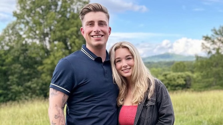 Colin Dooley and Baylen Dupree smiling in a field