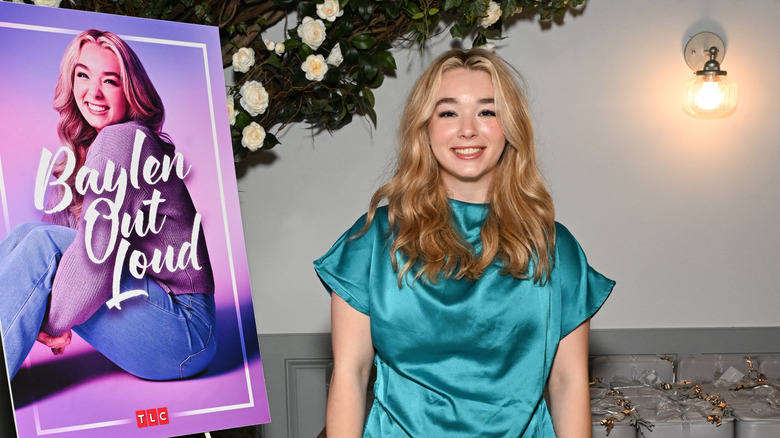 Baylen Dupree in front of a poster for her TLC show