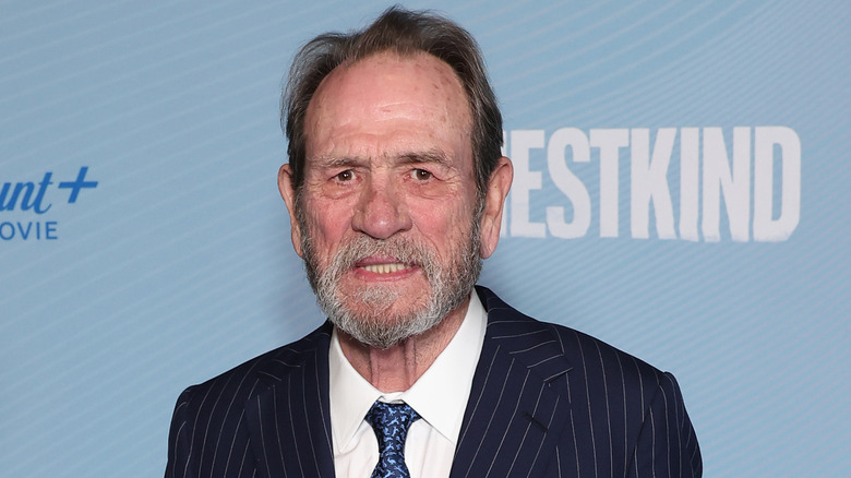 Tommy Lee Jones smiling on step-and-repeat