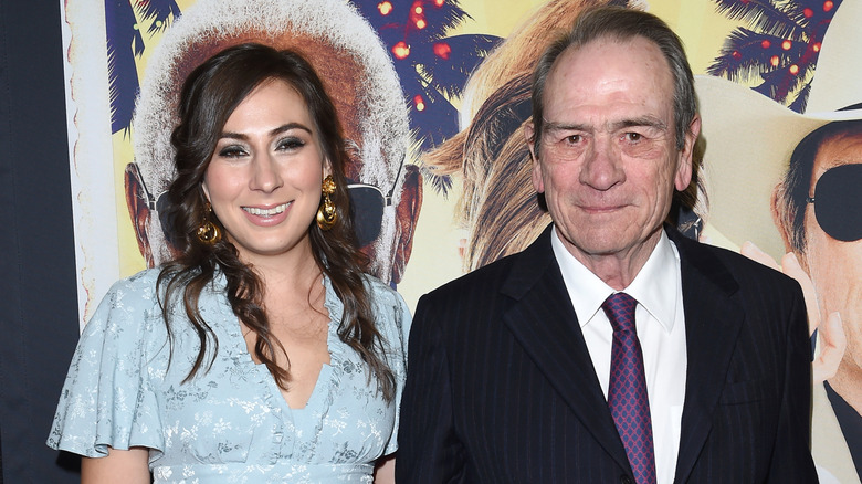 Victoria Jones and Tommy Lee Jones smiling on step-and-repeat