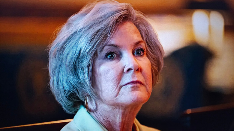 Susie Wiles looking serious in gold hoop earrings