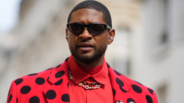 Usher wearing sunglasses 