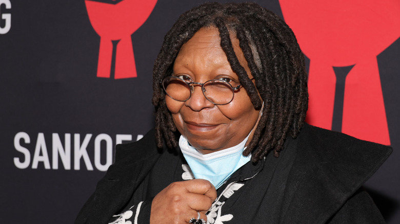 Whoopi Goldberg posing for photos