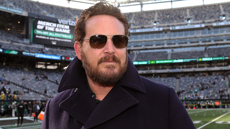 Cole Hauser looking at something at an event