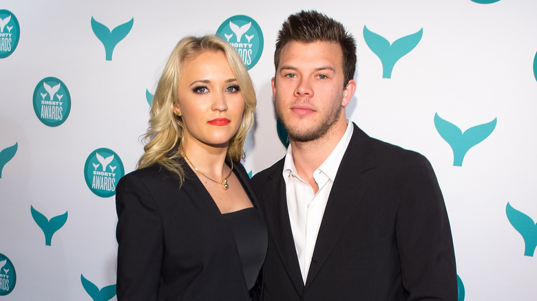 Emily Osment and Jimmy Tatro in black formals